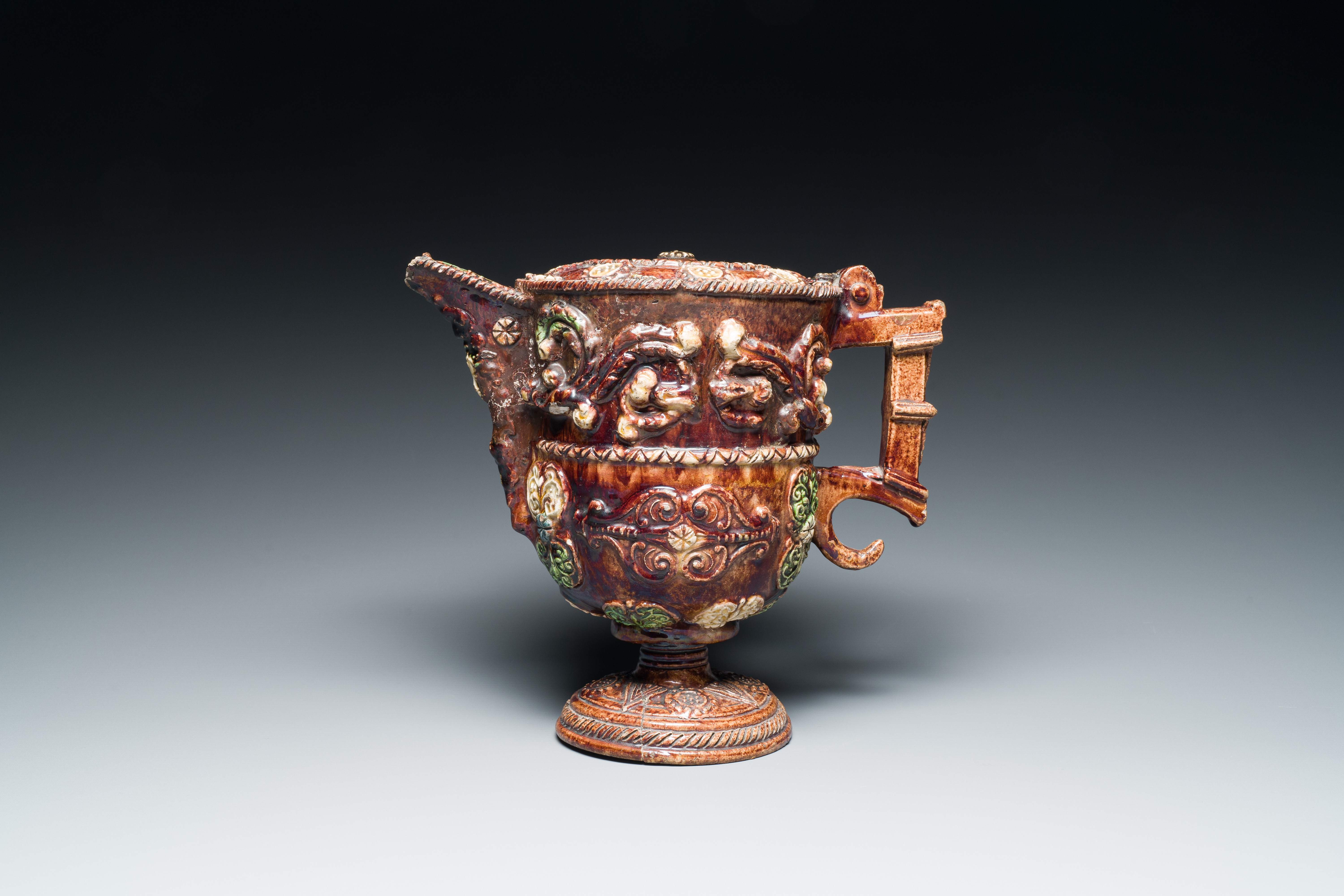 A French polychrome lead-glazed earthenware puzzle jug, Saintonge, 1st half 17th C. - Image 3 of 19
