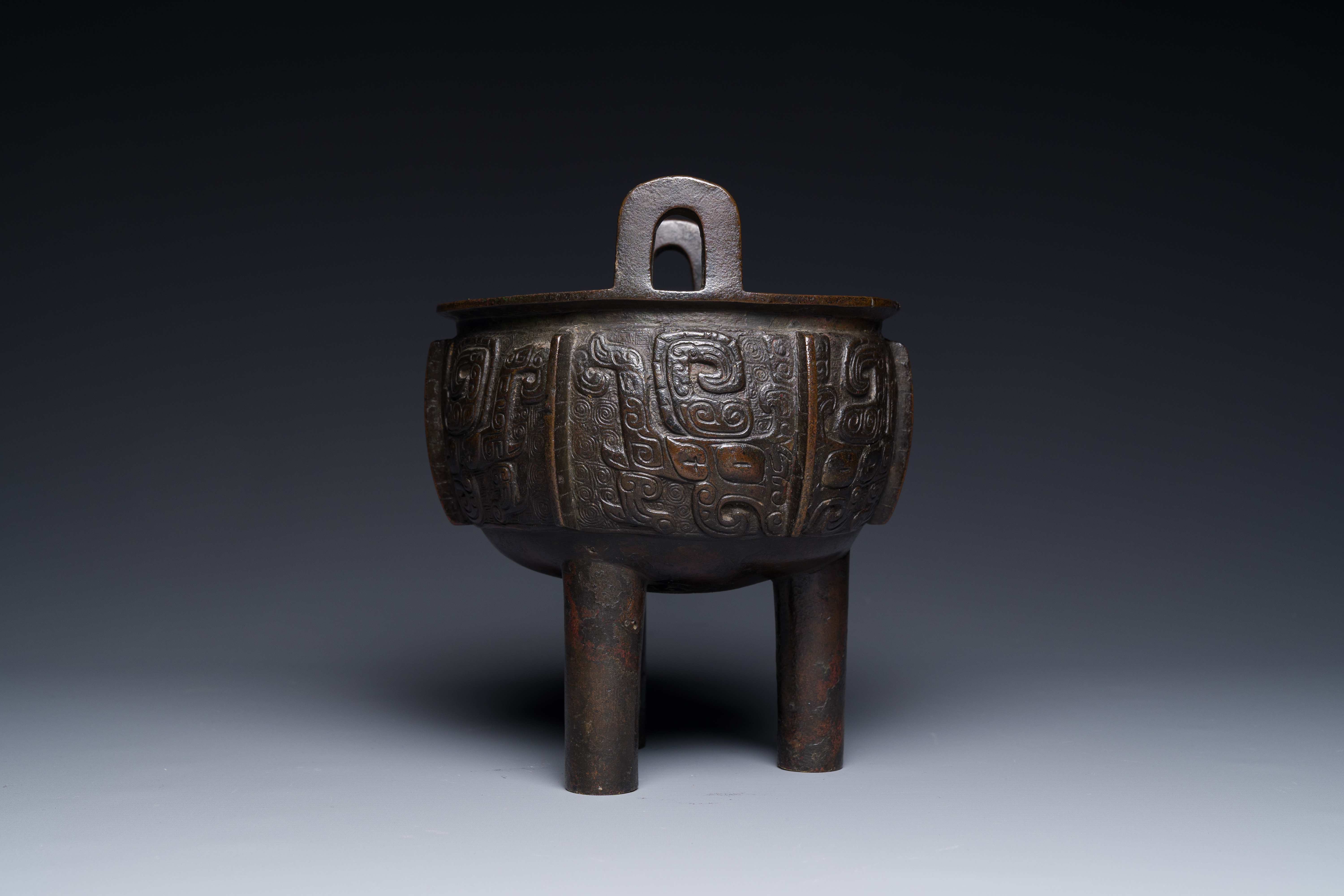 A Chinese archaistic bronze tripod censer on wooden stand, 'ding', Song/Ming - Image 14 of 21