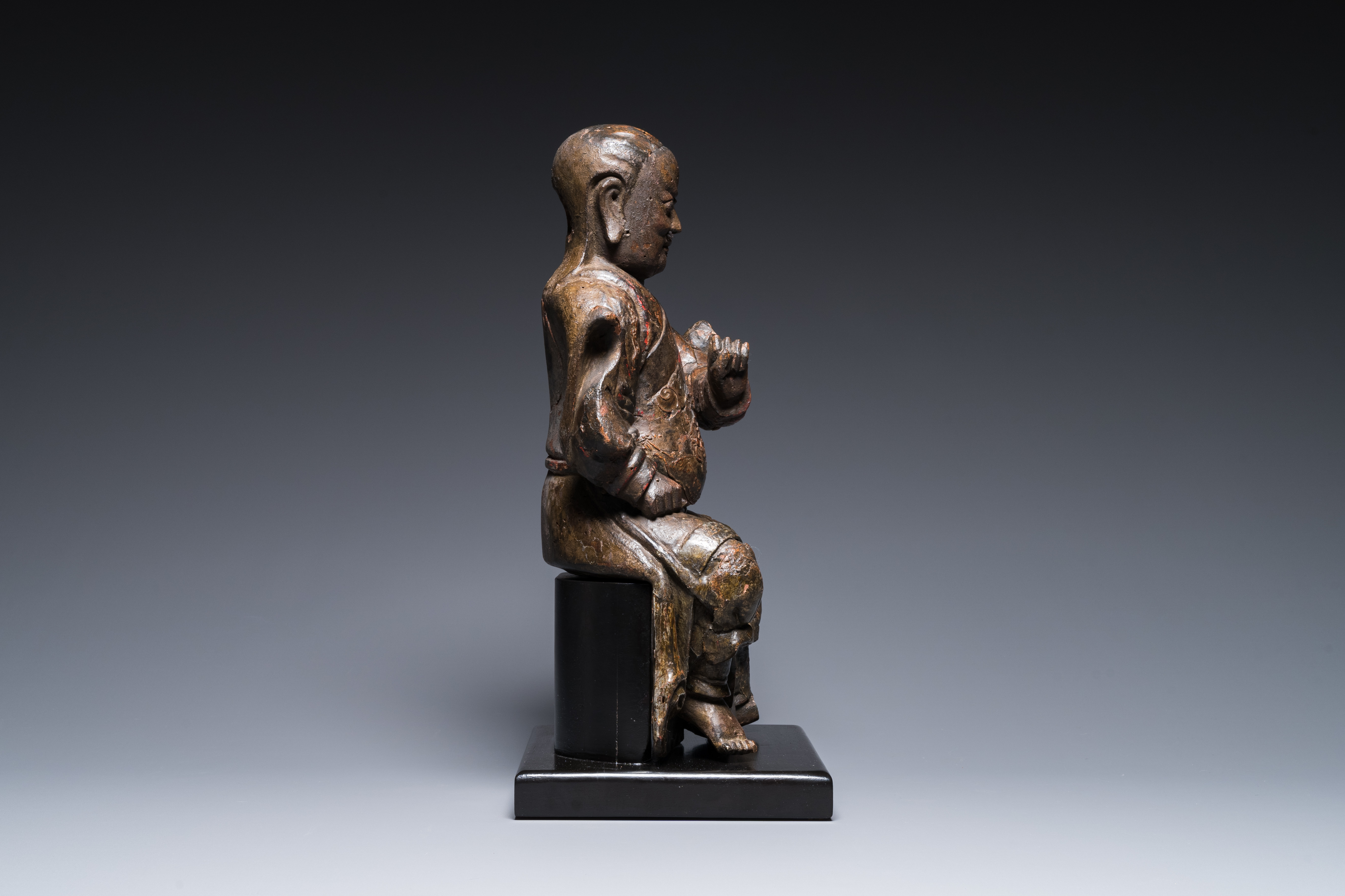 A Chinese lacquered and polychromed wood sculpture of a Buddhist guardian, Ming - Image 3 of 8