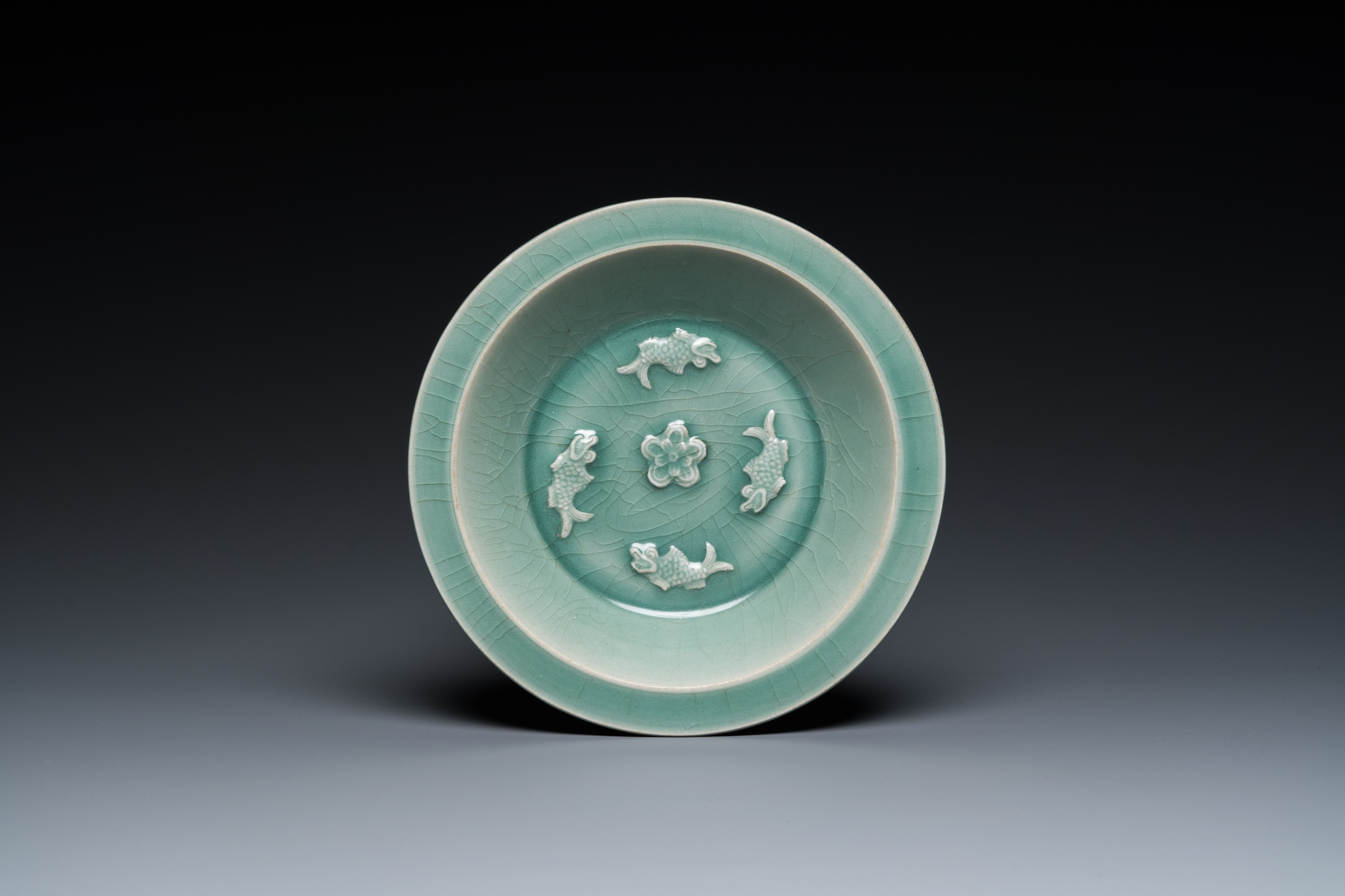 A Chinese Longquan celadon 'four carps' plate, Yuan or later