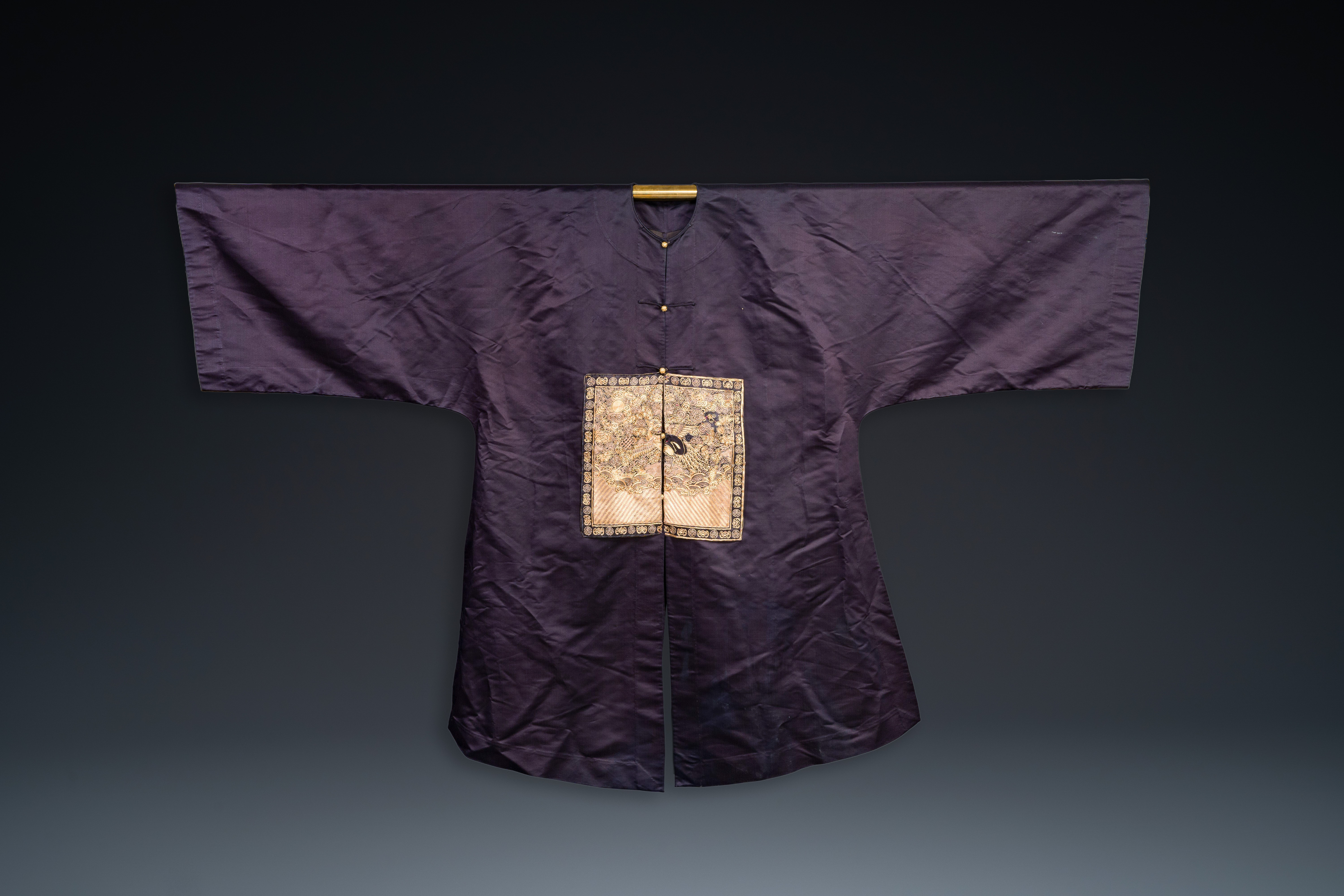 A Chinese dark blue silk overcoat with gold thread embroidered 'rank badges' with wild geese, 19th C