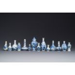 Fourteen Chinese blue and white miniature vases with floral design, Kangxi