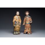 A pair of Chinese export polychrome decorated clay nodding head figures, 18/19th C.
