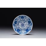 A Chinese blue and white 'lotus scroll' plate, Guangxu mark and of the period