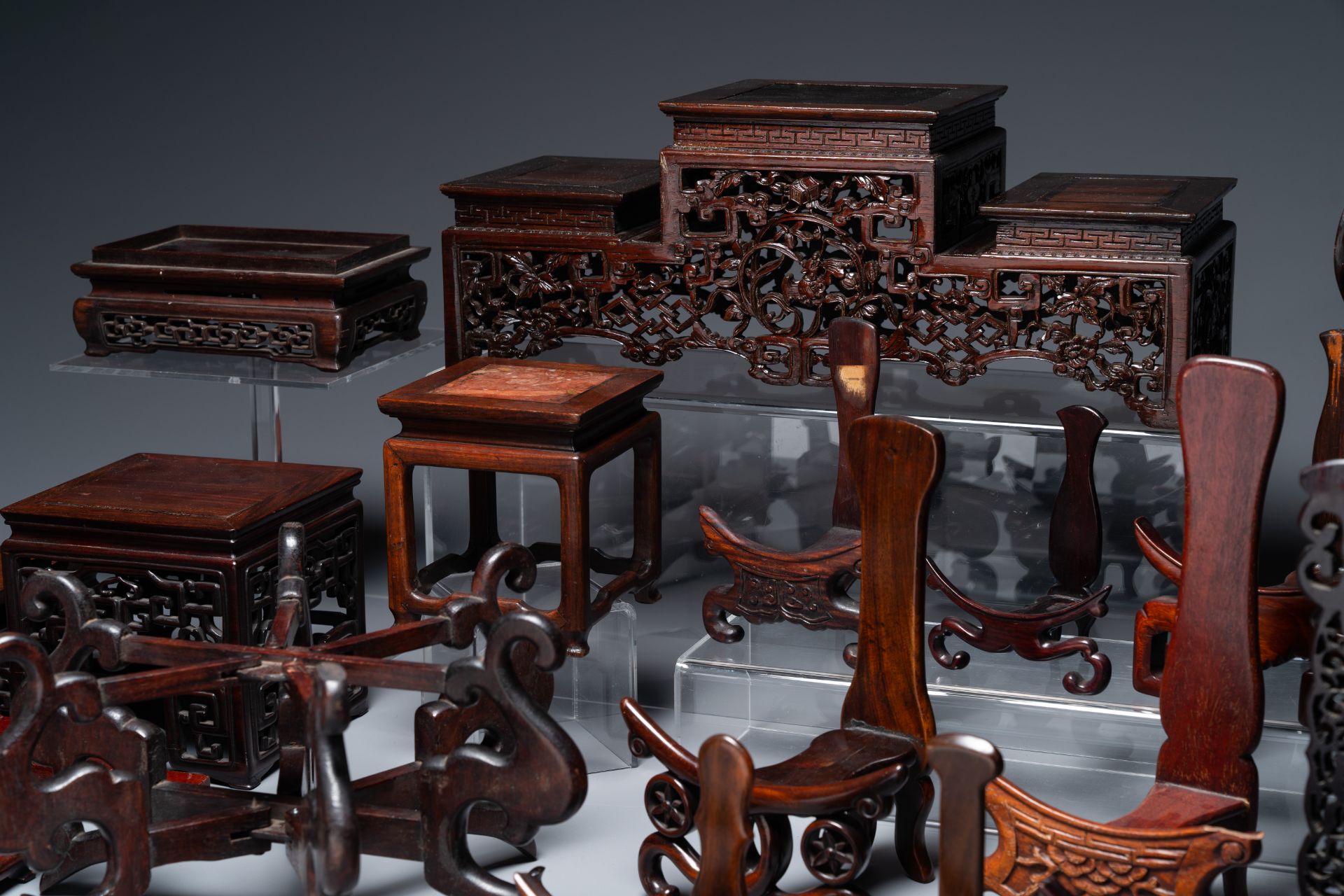 A collection of 26 varied Chinese wooden stands, 2 with marble tops, 19/20th C. - Bild 2 aus 6