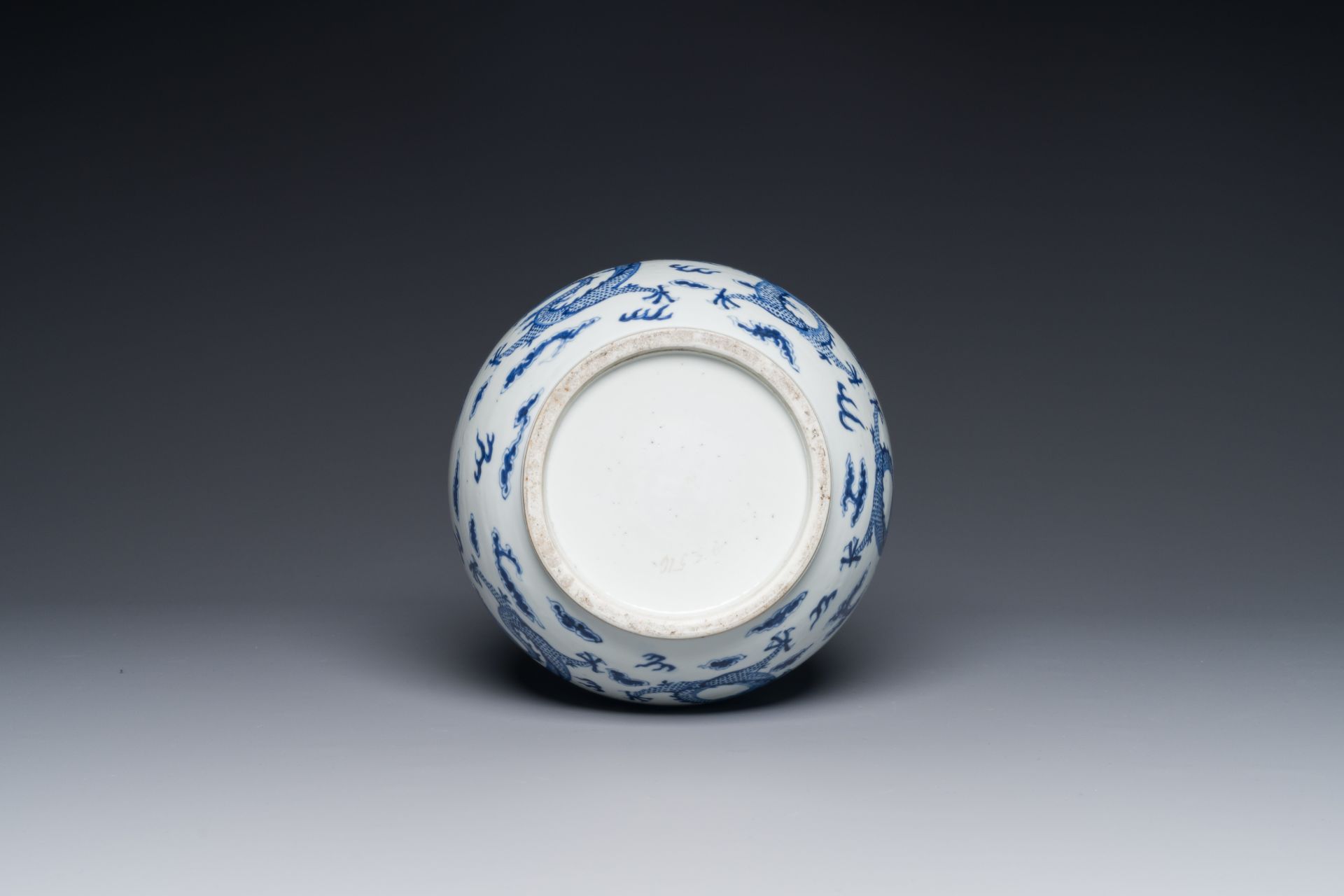 A Chinese blue and white bottle vase with dragons among flames and clouds, 19th C. - Image 3 of 3