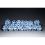 Ten Chinese blue and white cups and fourteen saucers with floral decor, lingzhi mark, Kangxi