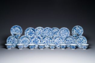 Ten Chinese blue and white cups and fourteen saucers with floral decor, lingzhi mark, Kangxi