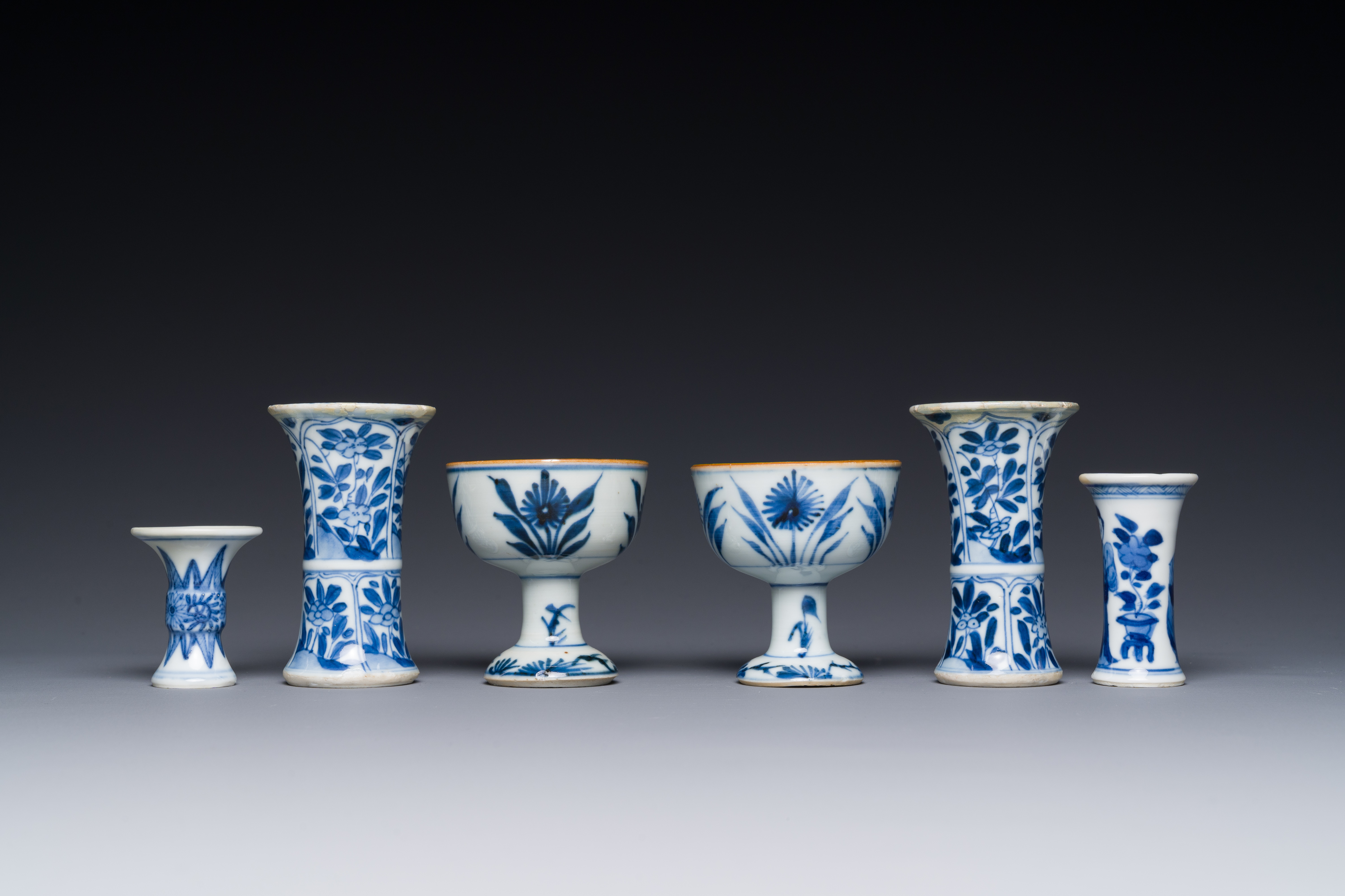 Two Chinese blue and white stem cups and four miniature 'gu' vases, Kangxi - Image 5 of 6