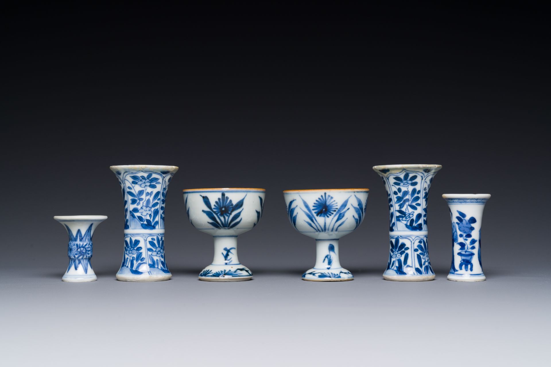 Two Chinese blue and white stem cups and four miniature 'gu' vases, Kangxi - Image 5 of 6