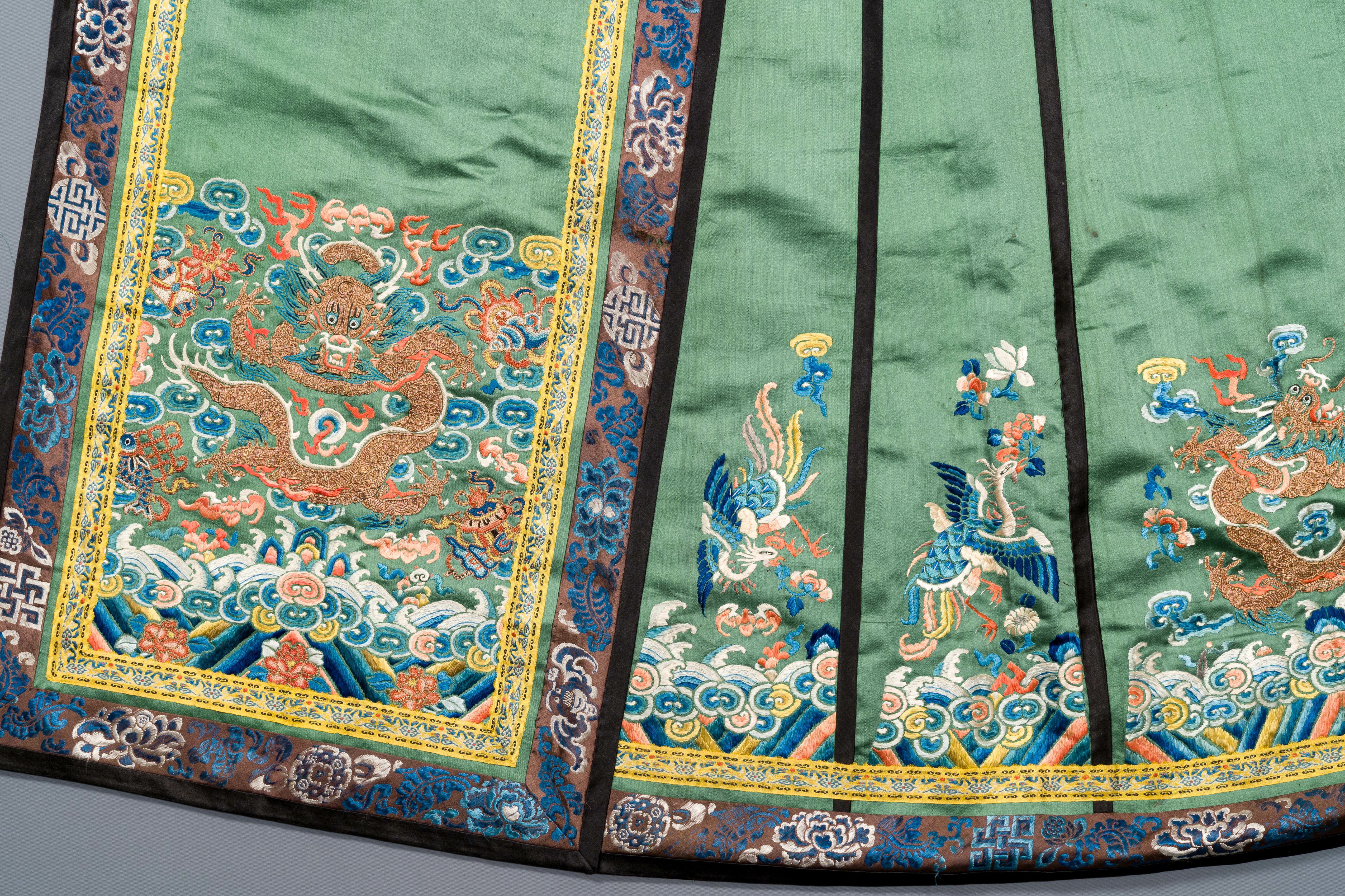 A Chinese embroidered silk 'dragon and phoenix' skirt and a wallet pouch, 18/19th C. - Image 10 of 10