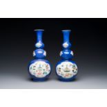 A pair of Chinese famille verte powder-blue-ground triple gourd 'antiquities' vases, Kangxi