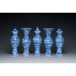 A Chinese blue and white garniture of five vases with floral design, Kangxi