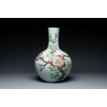 A Chinese famille rose relief-molded 'tianqiuping' vase with nine peaches, Qianlong mark, 19/20th C.