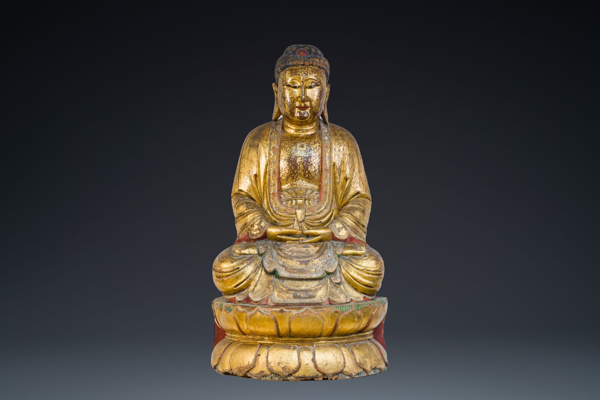 A large Chinese or Vietnamese gilded and polychromed wooden Buddha, 19th C.