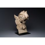 A Chinese pottery dragon head architectural tile, Song/Jin