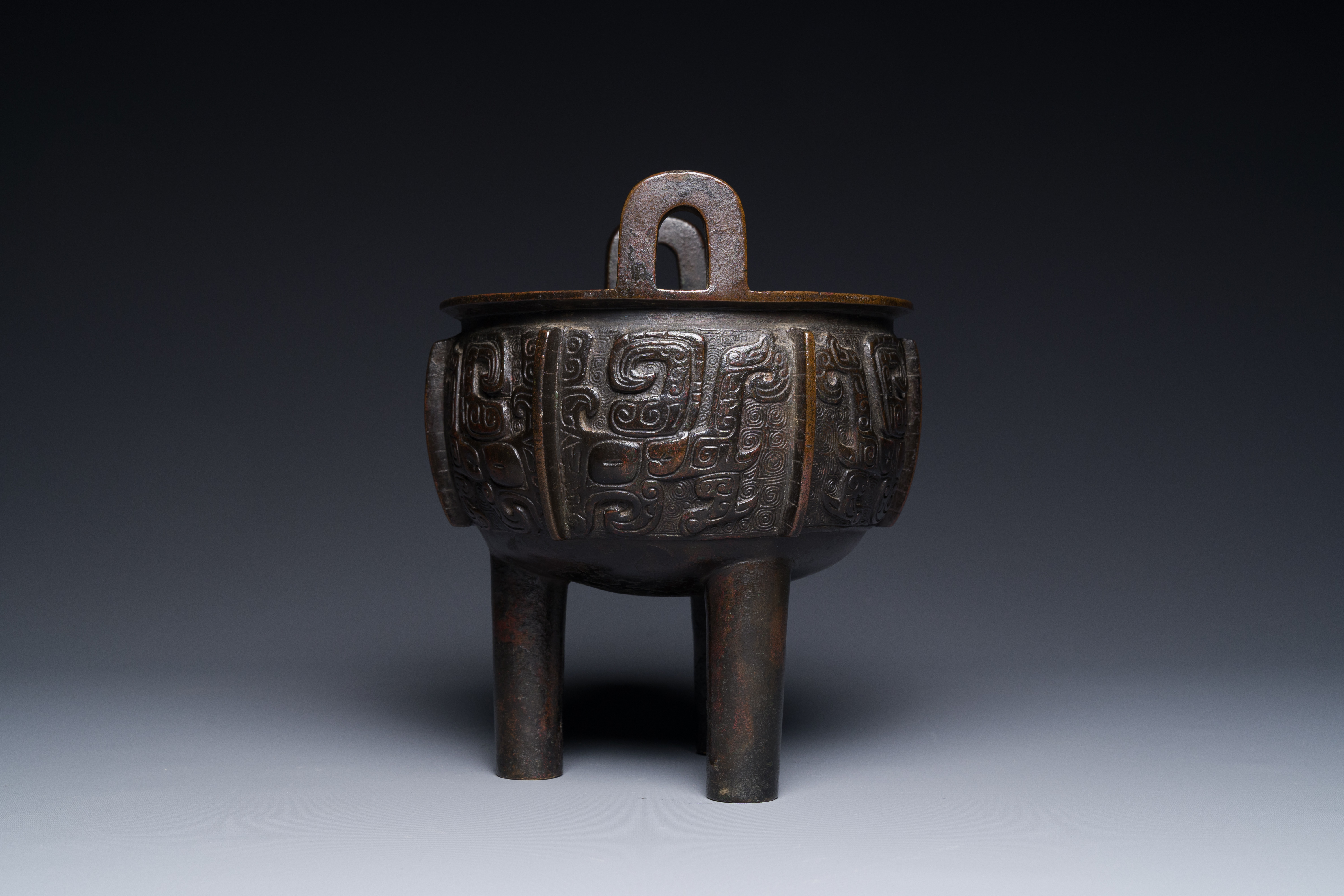 A Chinese archaistic bronze tripod censer on wooden stand, 'ding', Song/Ming - Image 8 of 21