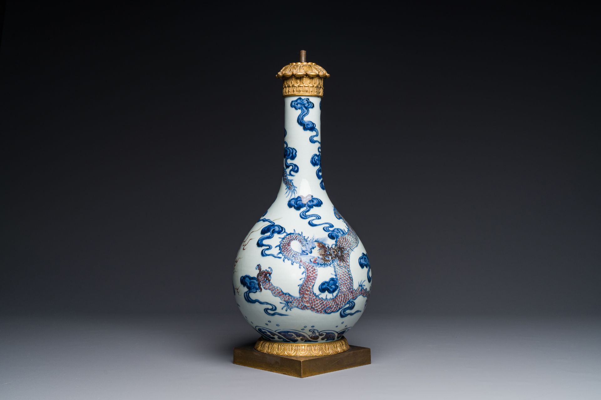 A Chinese blue, white and copper-red 'dragon' vase with gilt bronze mounts, 18th C.