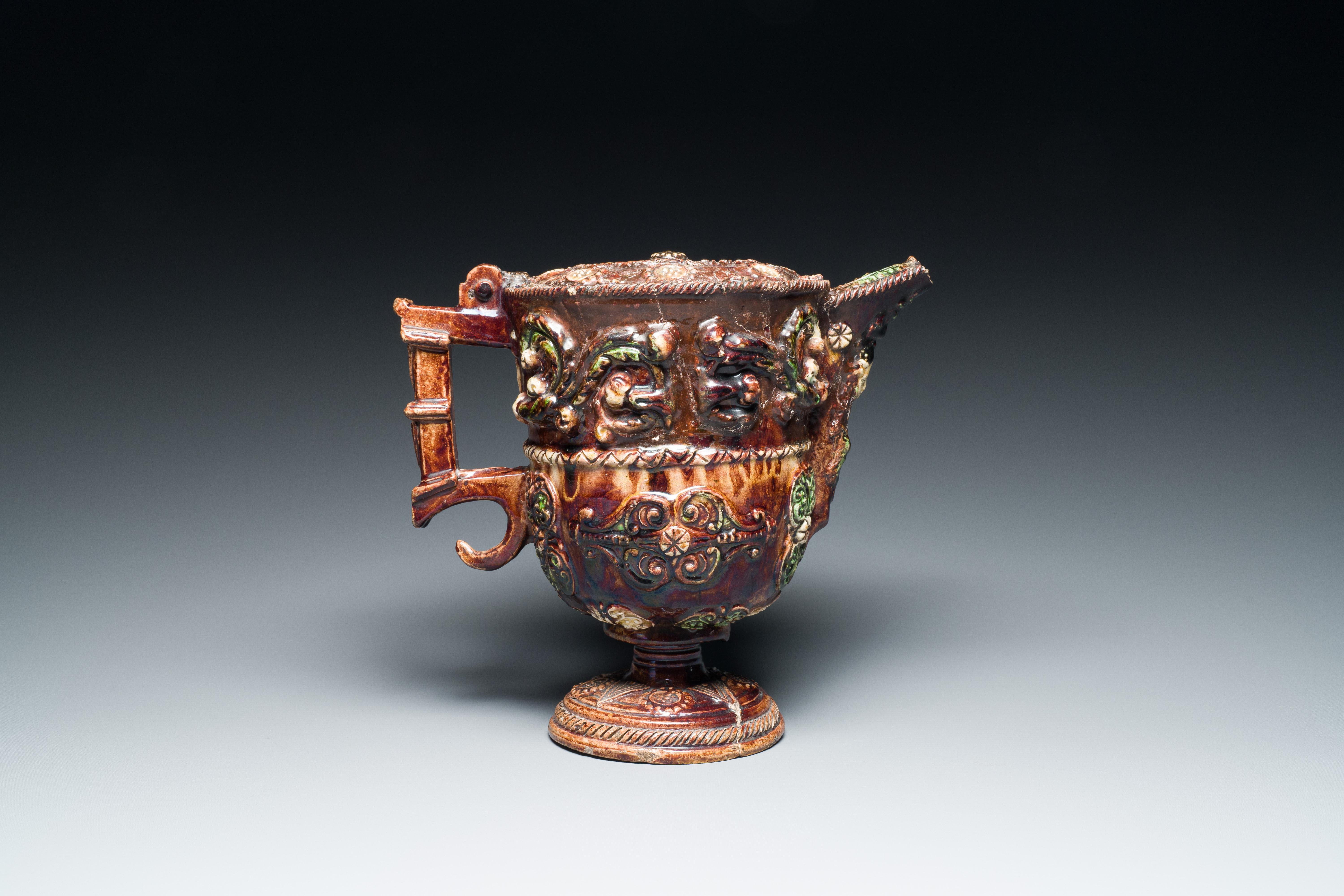 A French polychrome lead-glazed earthenware puzzle jug, Saintonge, 1st half 17th C. - Image 8 of 19