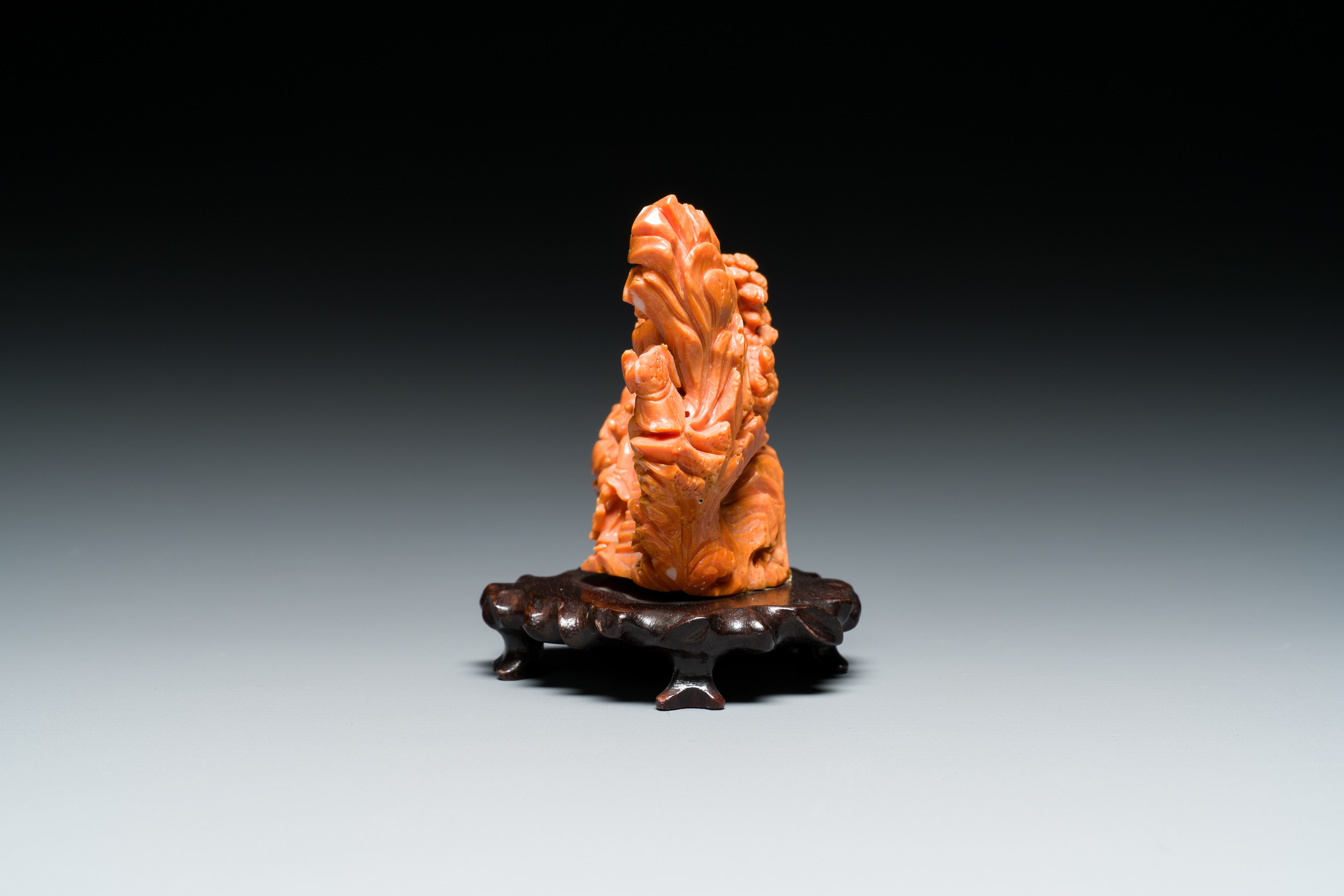 A Chinese red coral 'Eight Immortals' group on wooden stand, 19/20th C. - Image 4 of 14