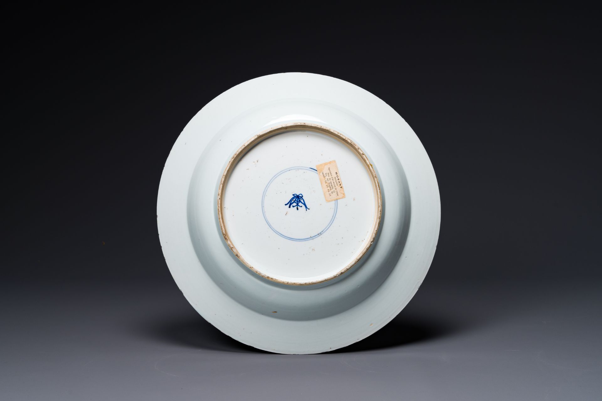 A Chinese blue and white dish with landscape and floral panels, Kangxi - Image 2 of 2