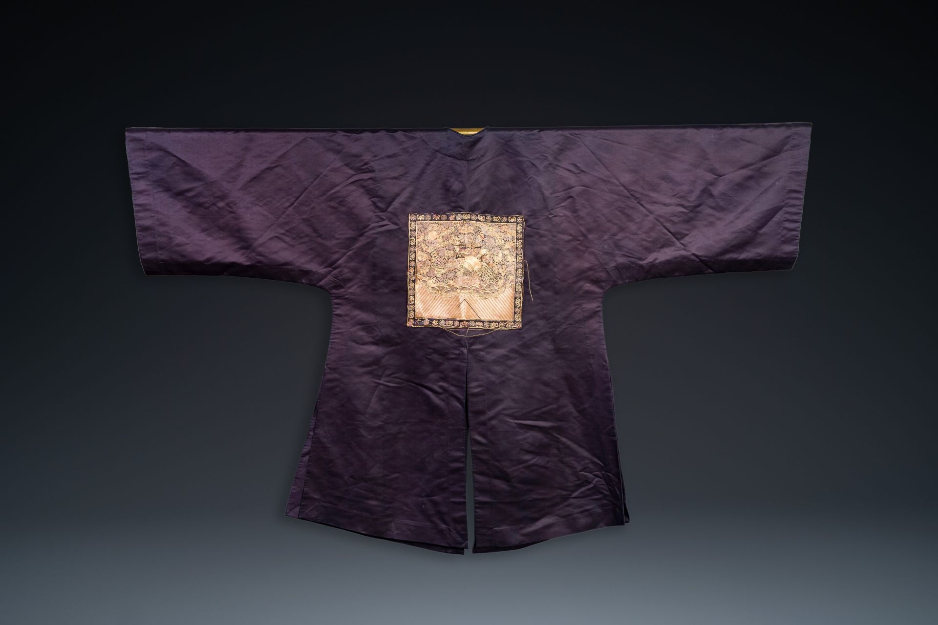 A Chinese dark blue silk overcoat with gold thread embroidered 'rank badges' with wild geese, 19th C - Image 3 of 3