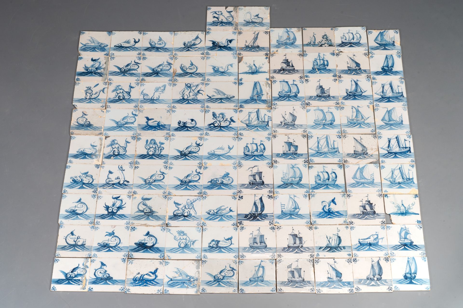 92 blue and white Dutch Delft tiles with sea monsters and ships, 18th C.