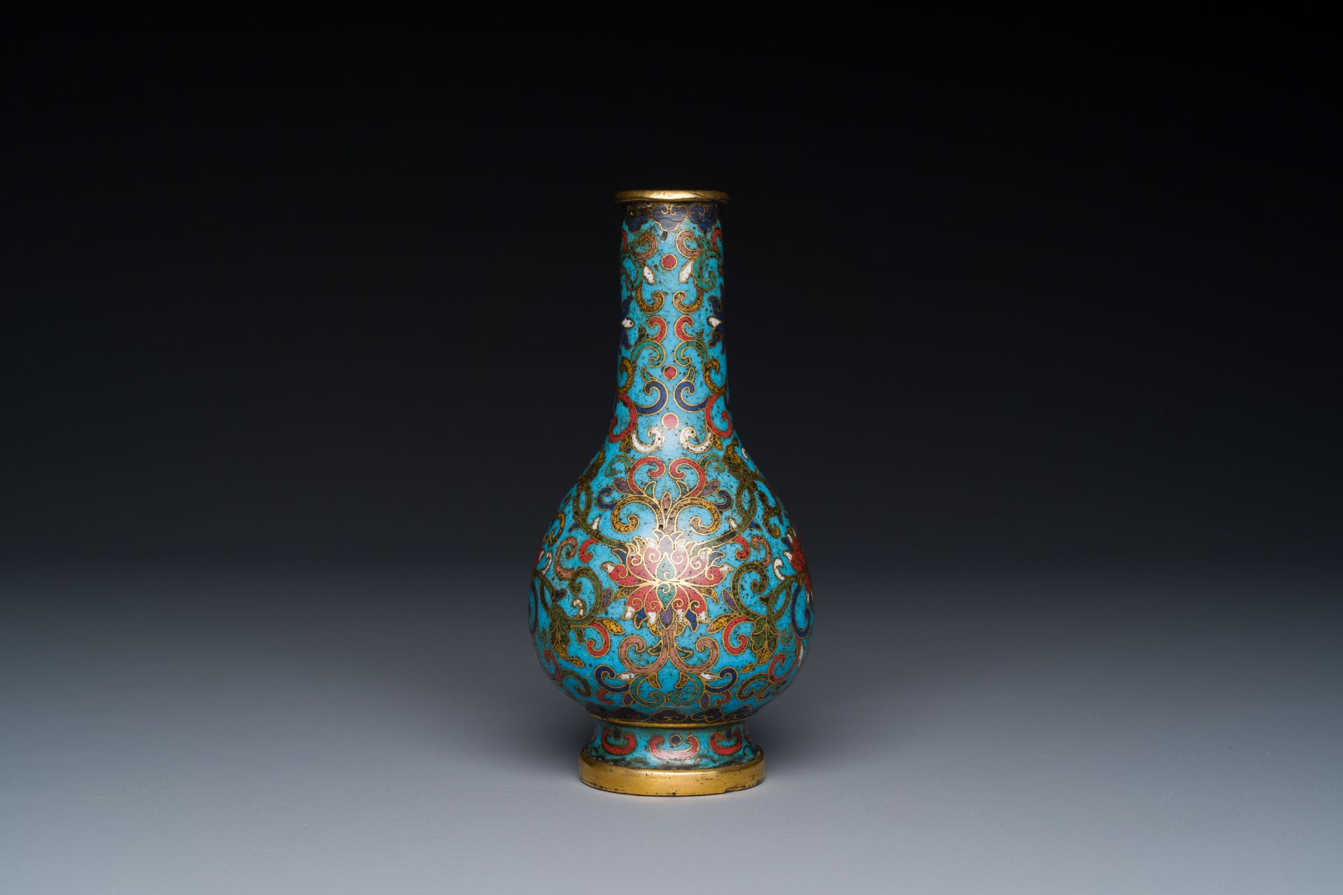 A small Chinese cloisonne 'lotus scroll' bottle vase, Qianlong mark and of the period