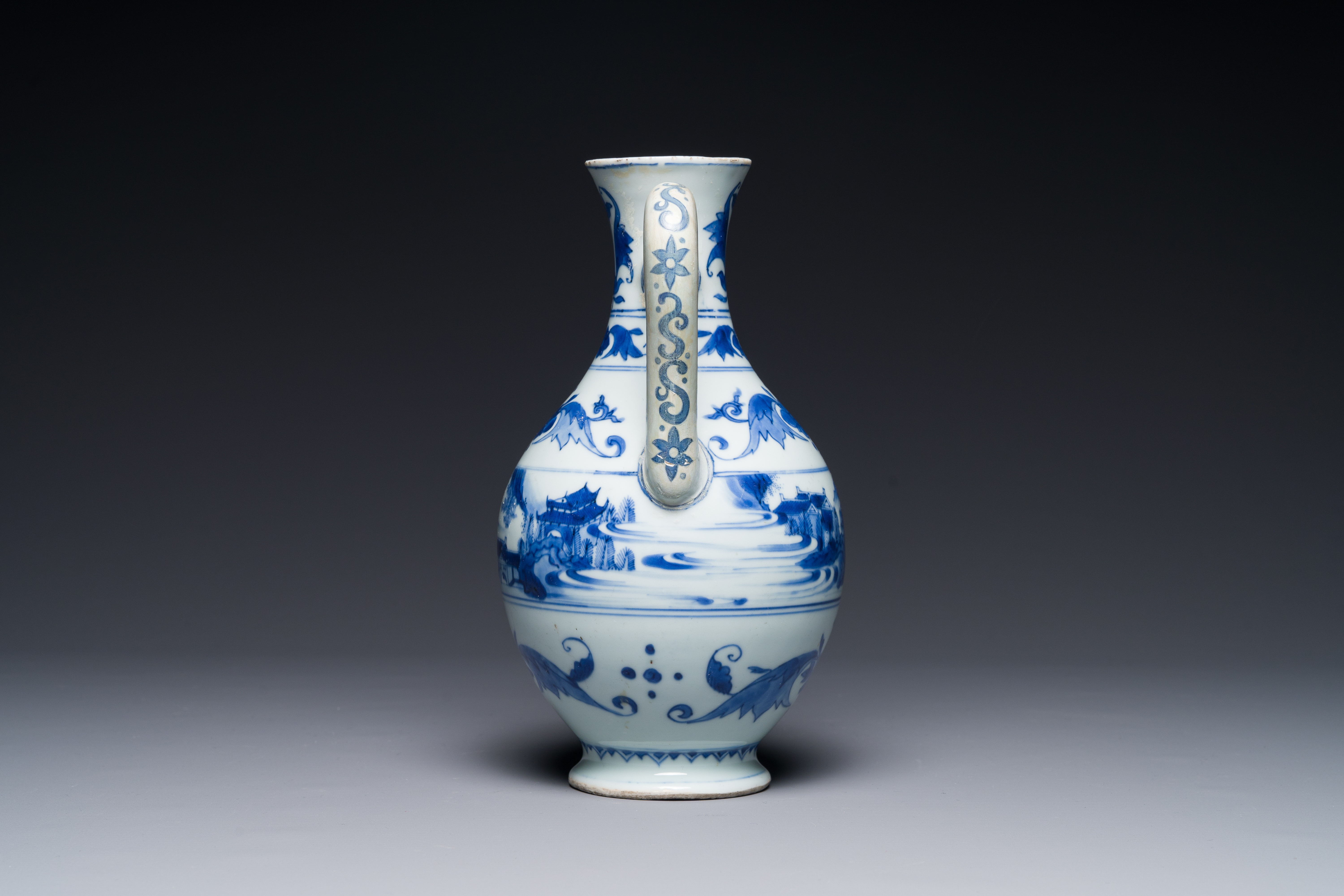 A Chinese blue and white ewer with landscape design, Transitional period - Image 3 of 4