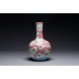 A Chinese blue, white and copper-red 'dragon' tianqiu ping' vase, 18th C.