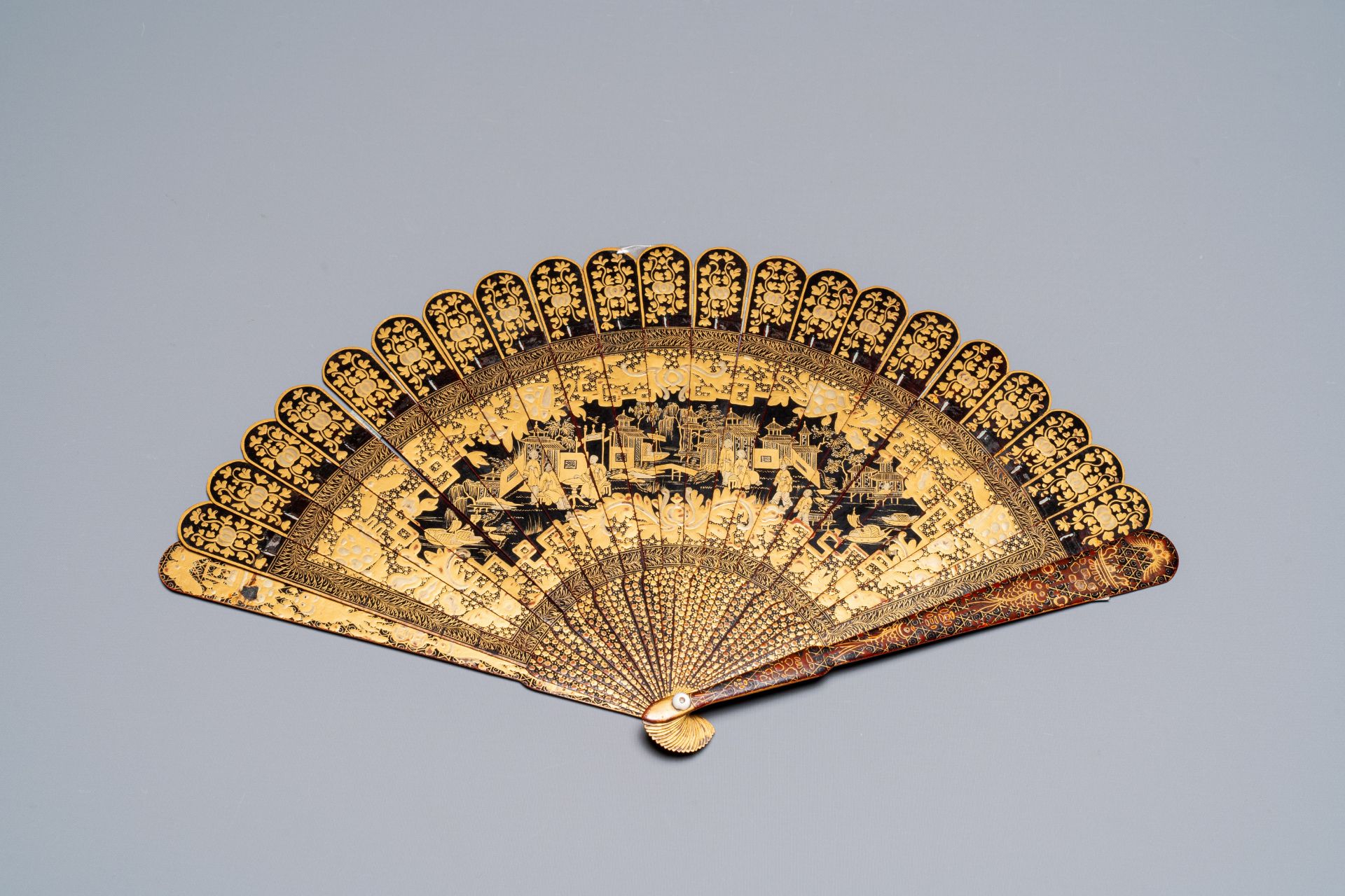 A large Chinese Canton gilt black lacquer tray, thee boxes and a fan, 19th C. - Image 4 of 17