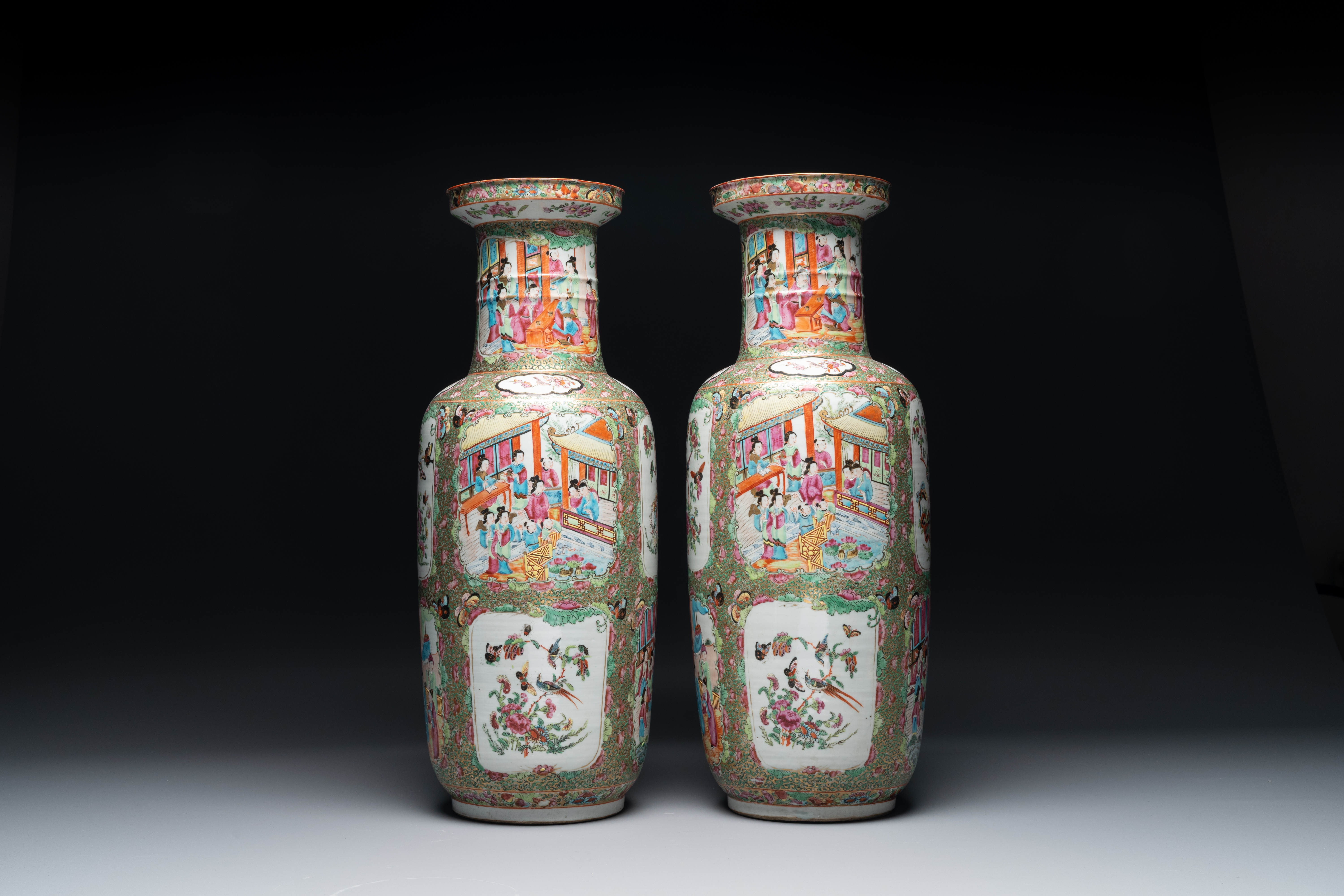 A pair of Chinese Canton famille rose rouleau vases, 19th C.