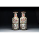 A pair of Chinese Canton famille rose rouleau vases, 19th C.