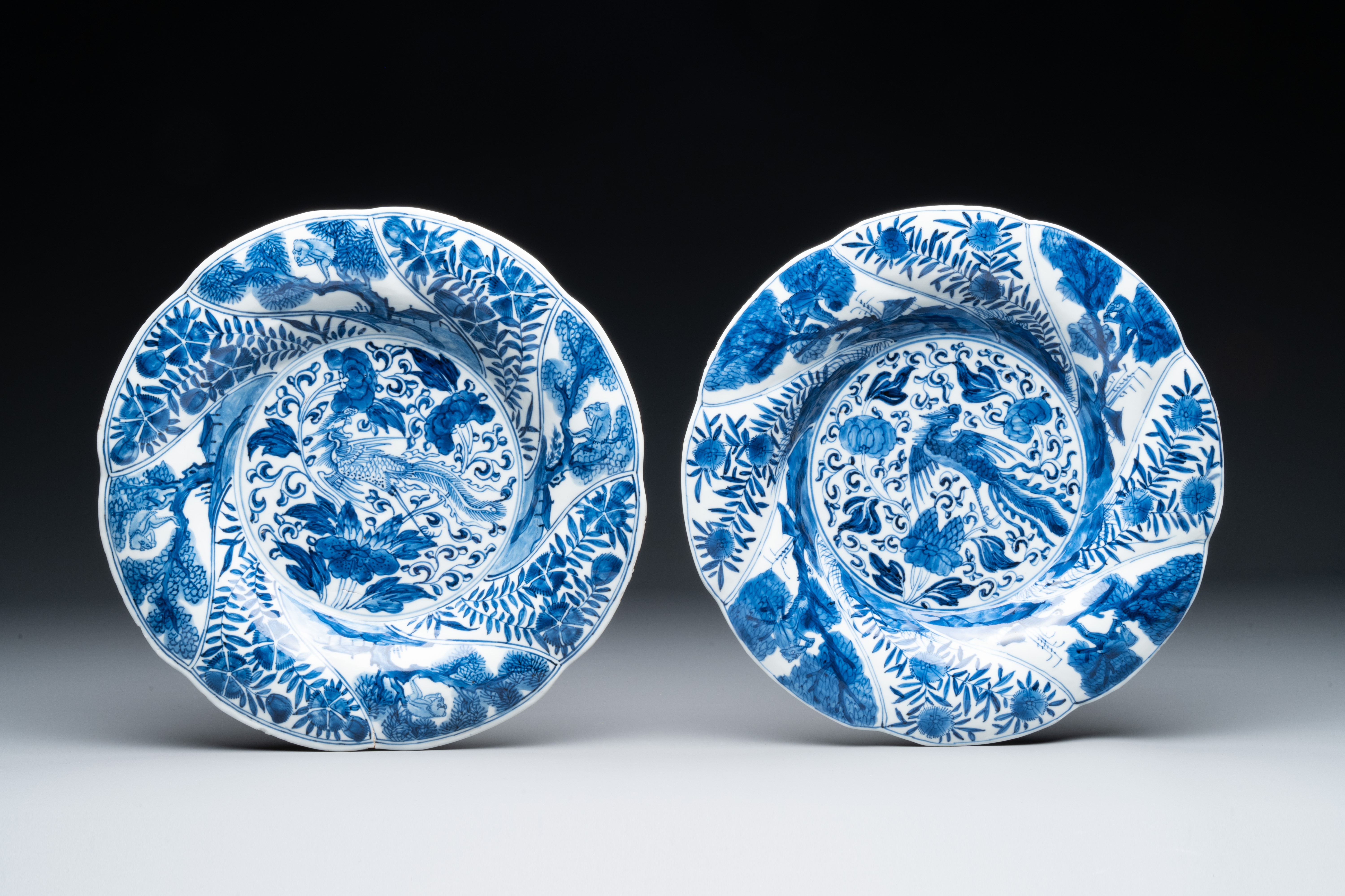 Four Chinese blue and white lobed 'phoenix and monkey' plates, flower mark, Kangxi - Image 3 of 5