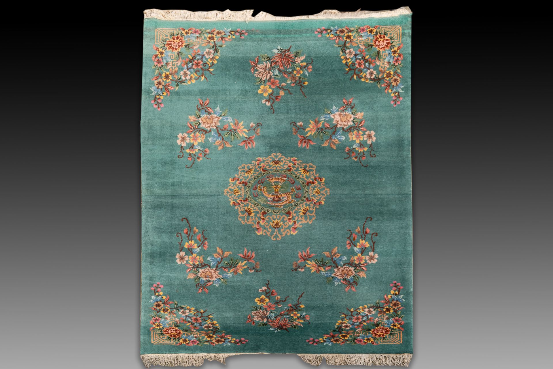 A large Chinese emerald-green-ground carpet with floral design, Republic