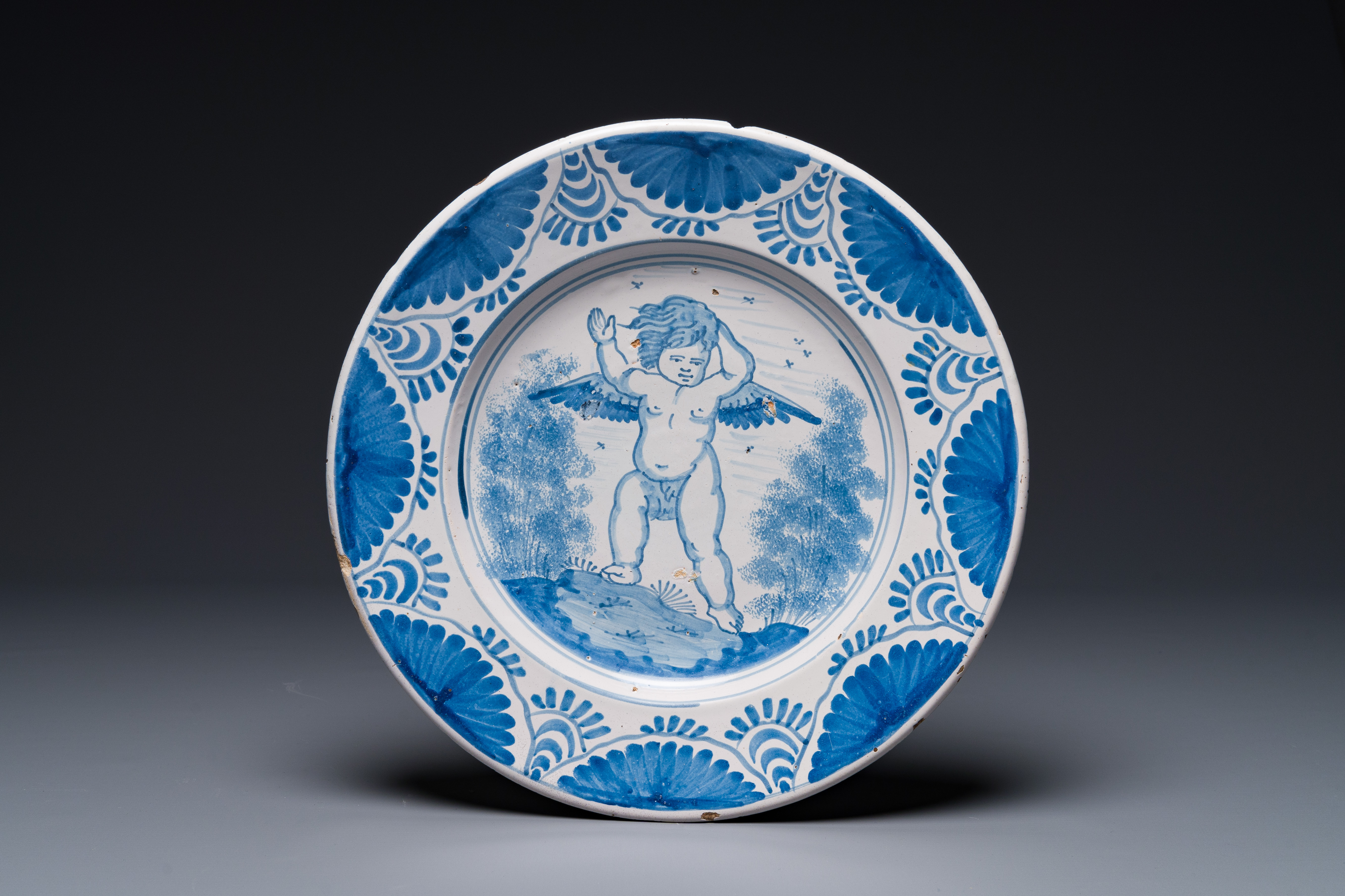 An attractive blue and white Dutch maiolica dish with a winged cherub, probably Harlingen, 2nd half