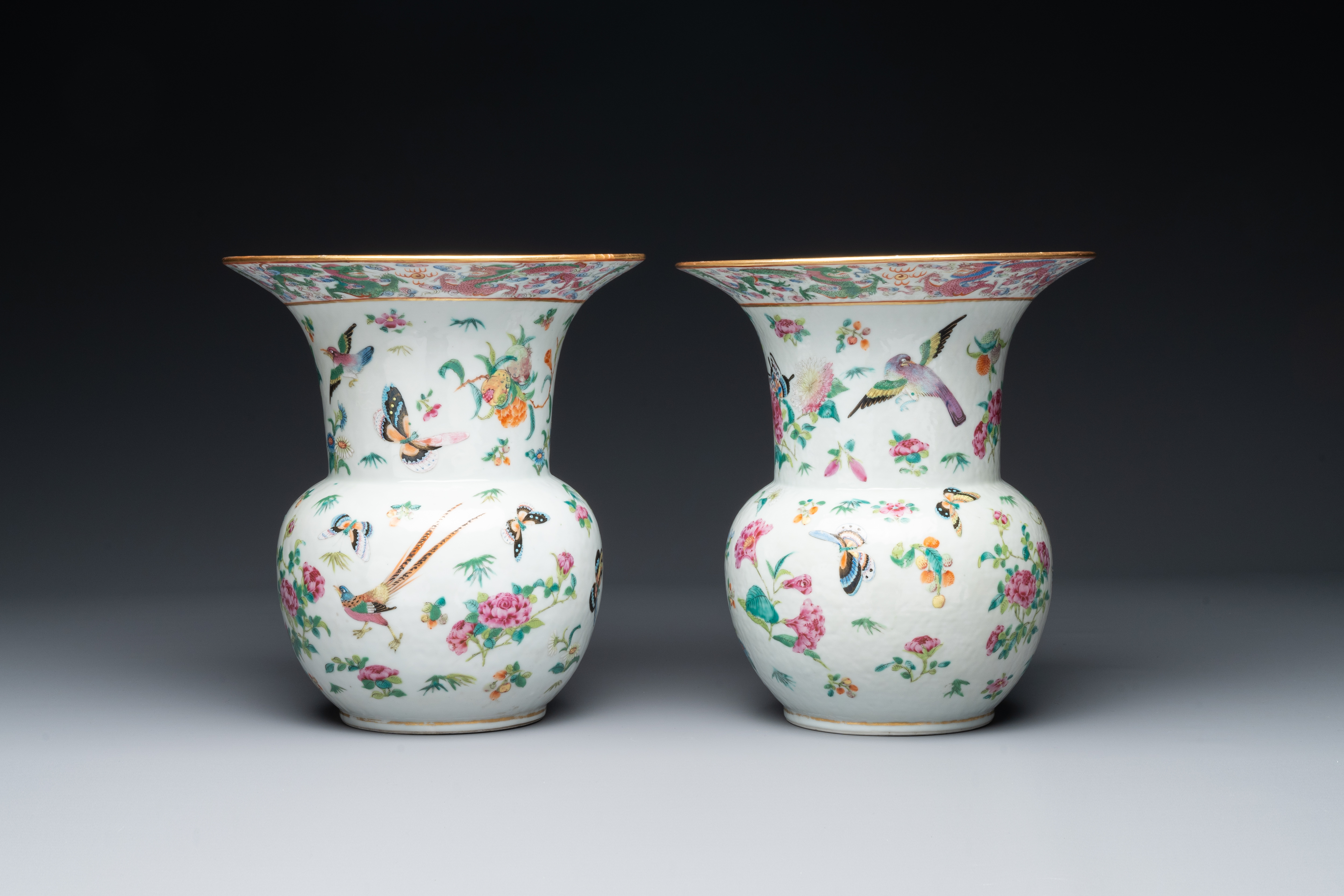 A pair of Chinese Canton famille rose spittoons with dragons, birds, butterflies and flowers, 19th C - Image 3 of 6