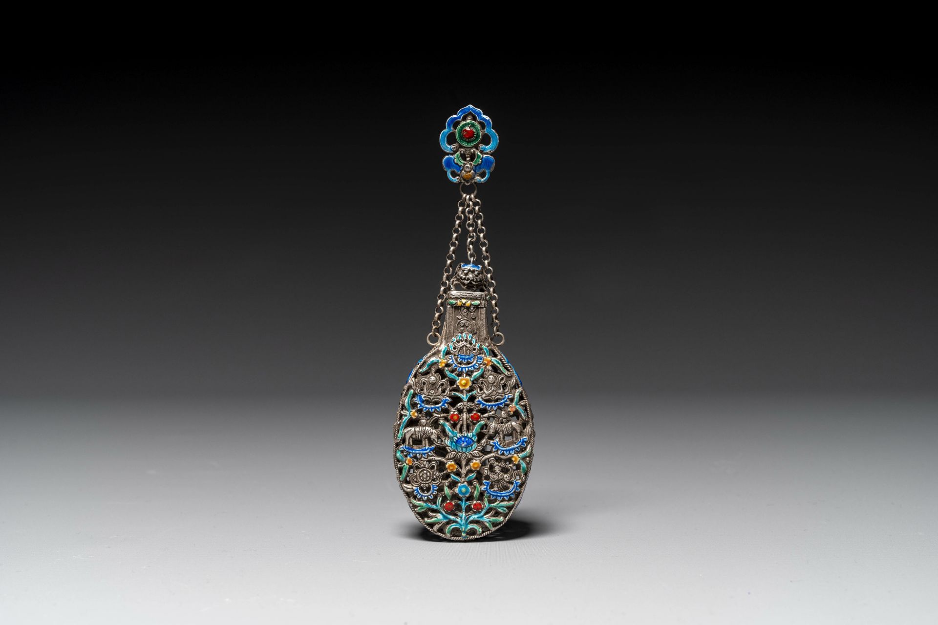 A Chinese openworked and partly enamelled silver bottle, 19th C.