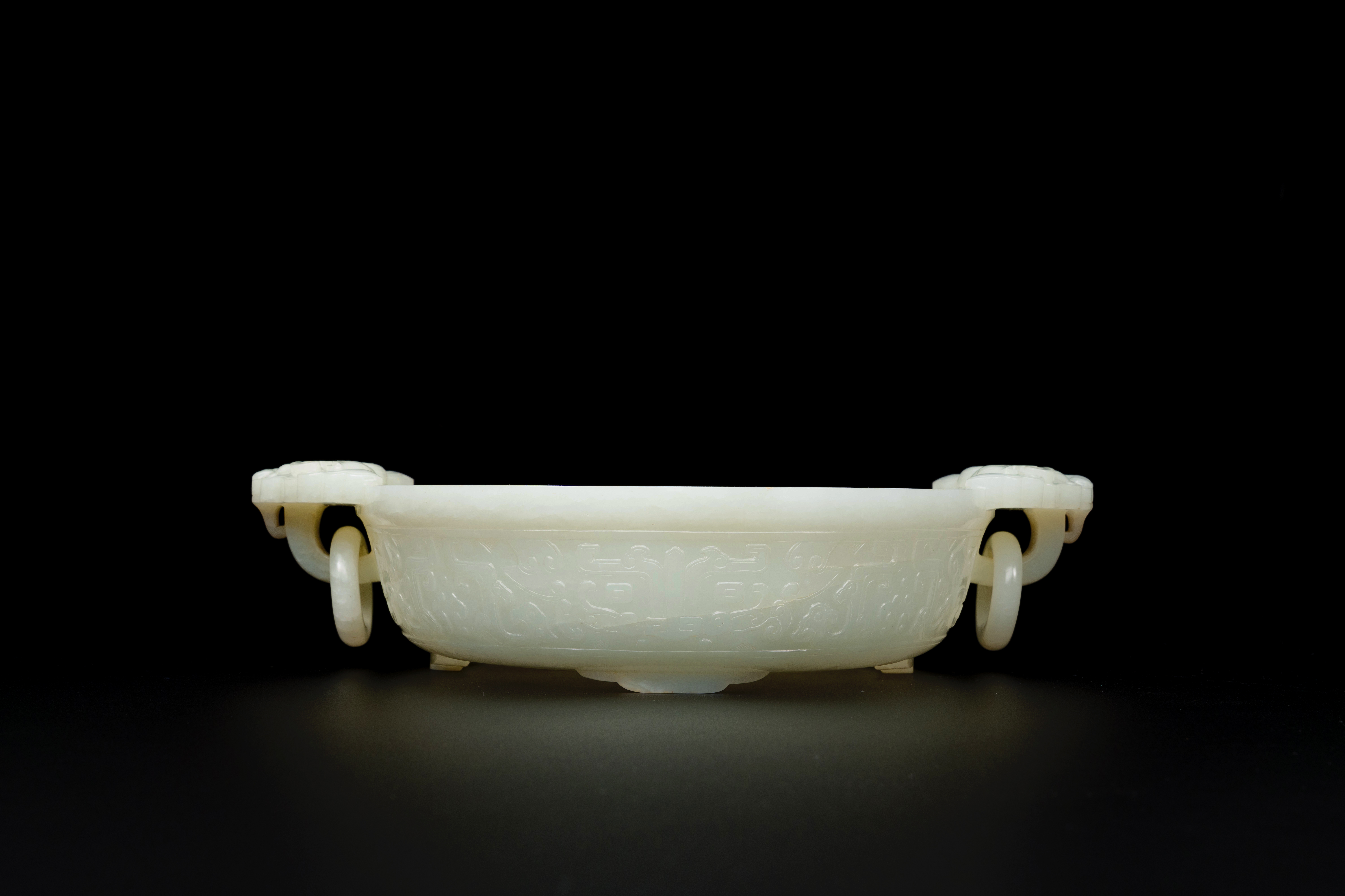 An important Chinese chrysanthemum-shaped very pale celadon jade marriage bowl, 18th C.