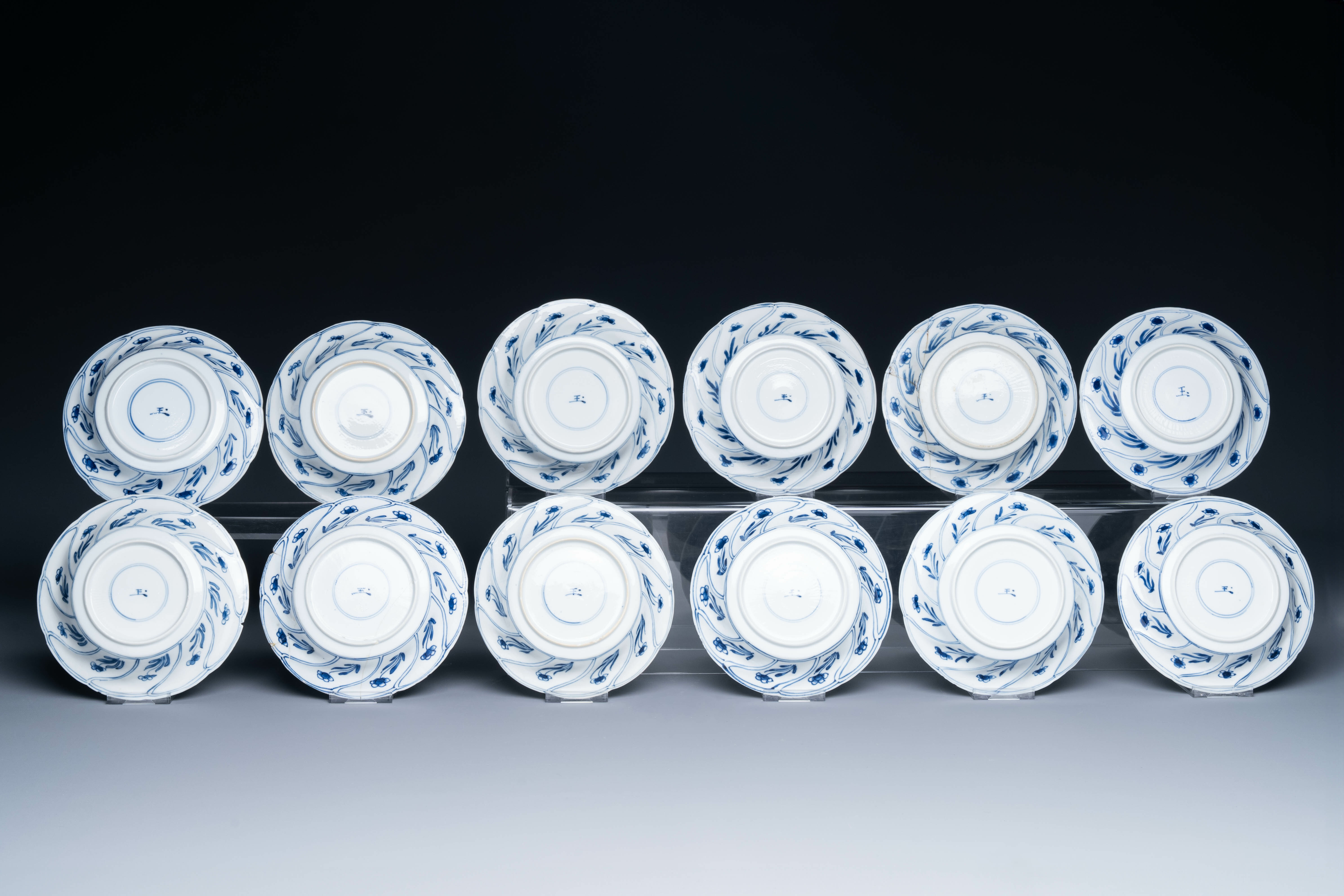 Twelve Chinese blue and white cups and saucers with floral design, jade mark, Kangxi - Image 3 of 7