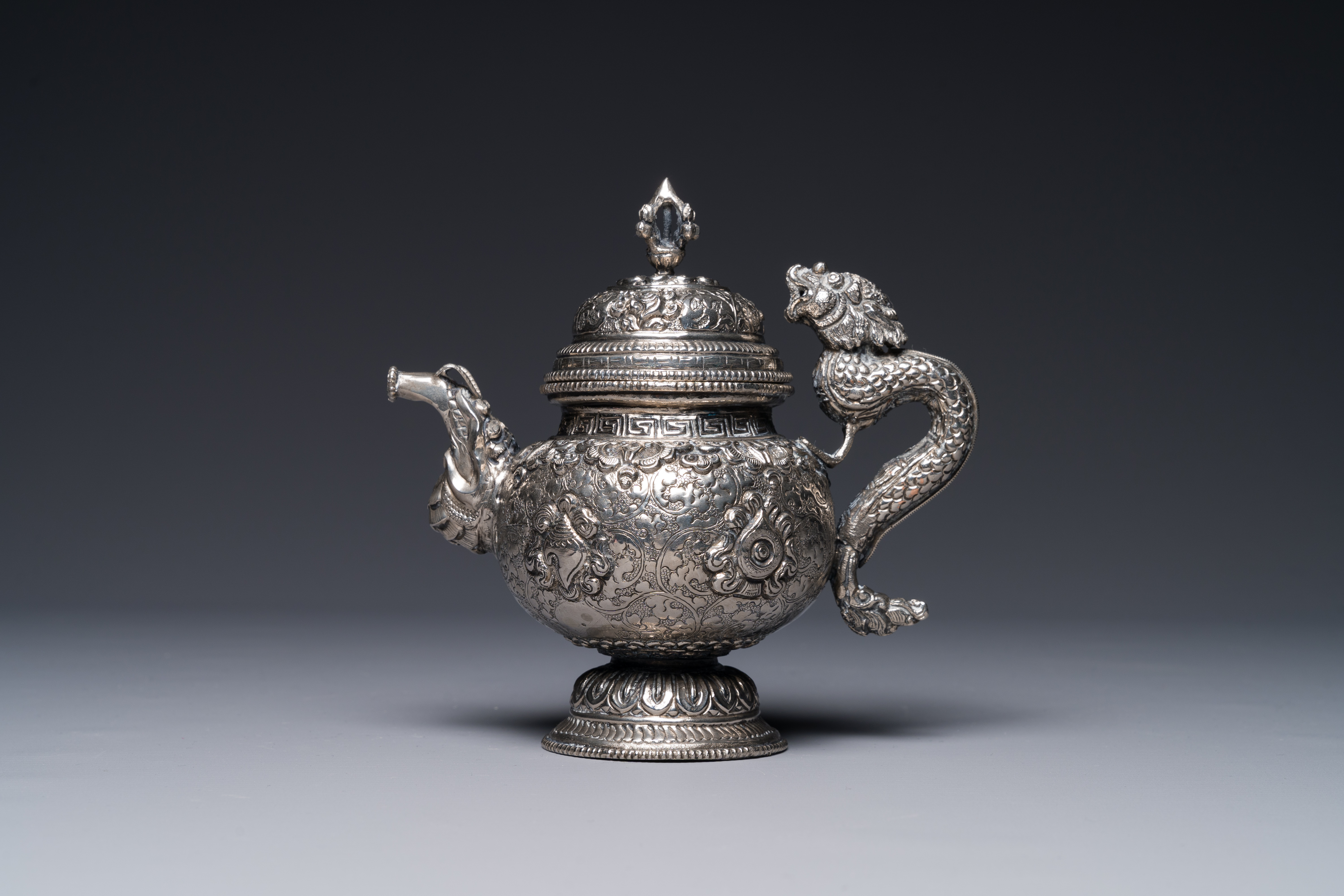 A fine Tibetan silver plated 'bajixiang' teapot, 19th C.