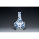 A Chinese blue and white bottle vase with dragons among flames and clouds, 19th C.