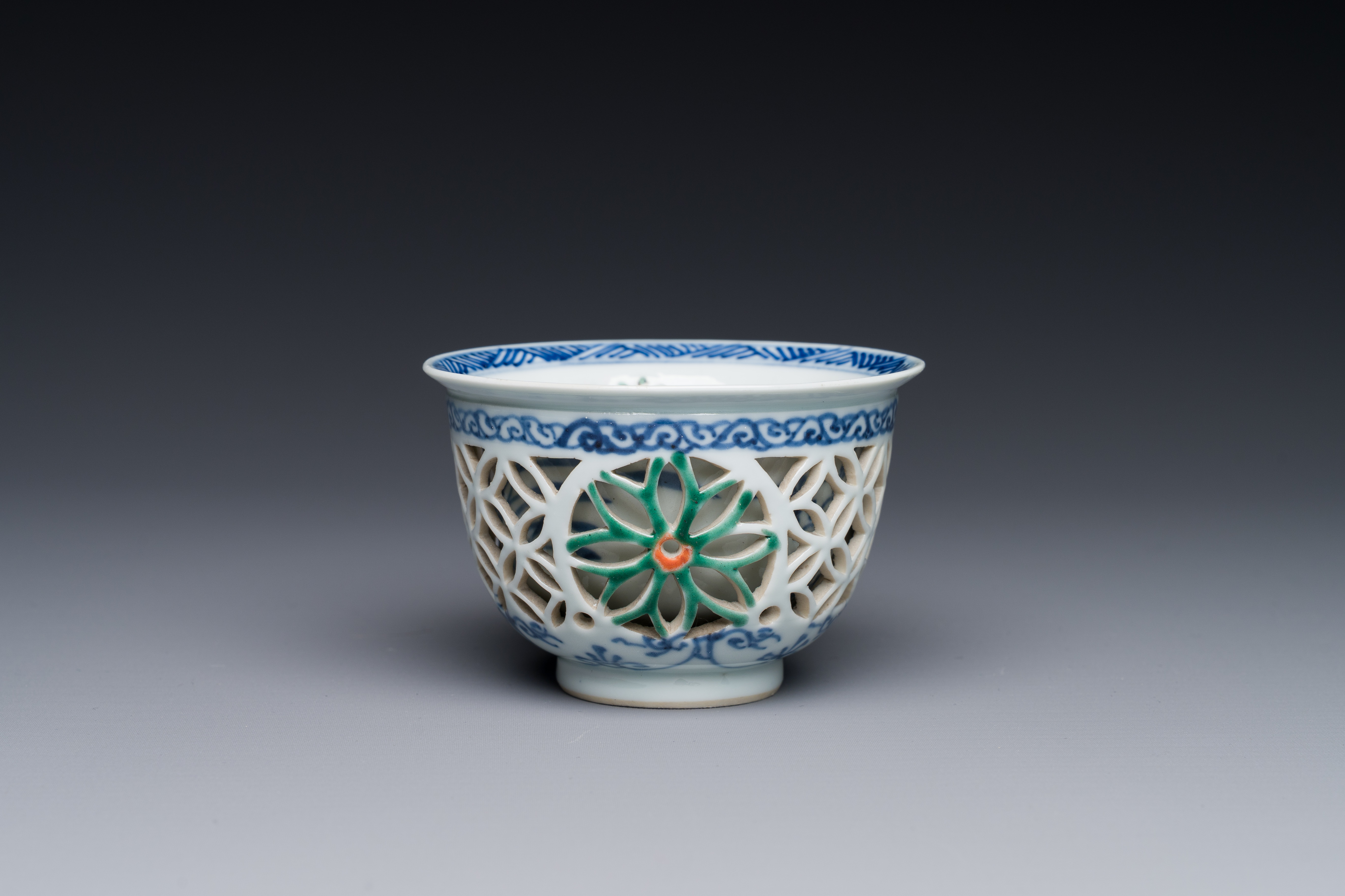 A rare Chinese reticulated double-walled famille verte cup, Kangxi