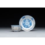 A Chinese blue and white reticulated double-walled cup and saucer, Kangxi