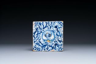 A fine Dutch Delft polychrome maiolica tile with a cherub, ca. 1600