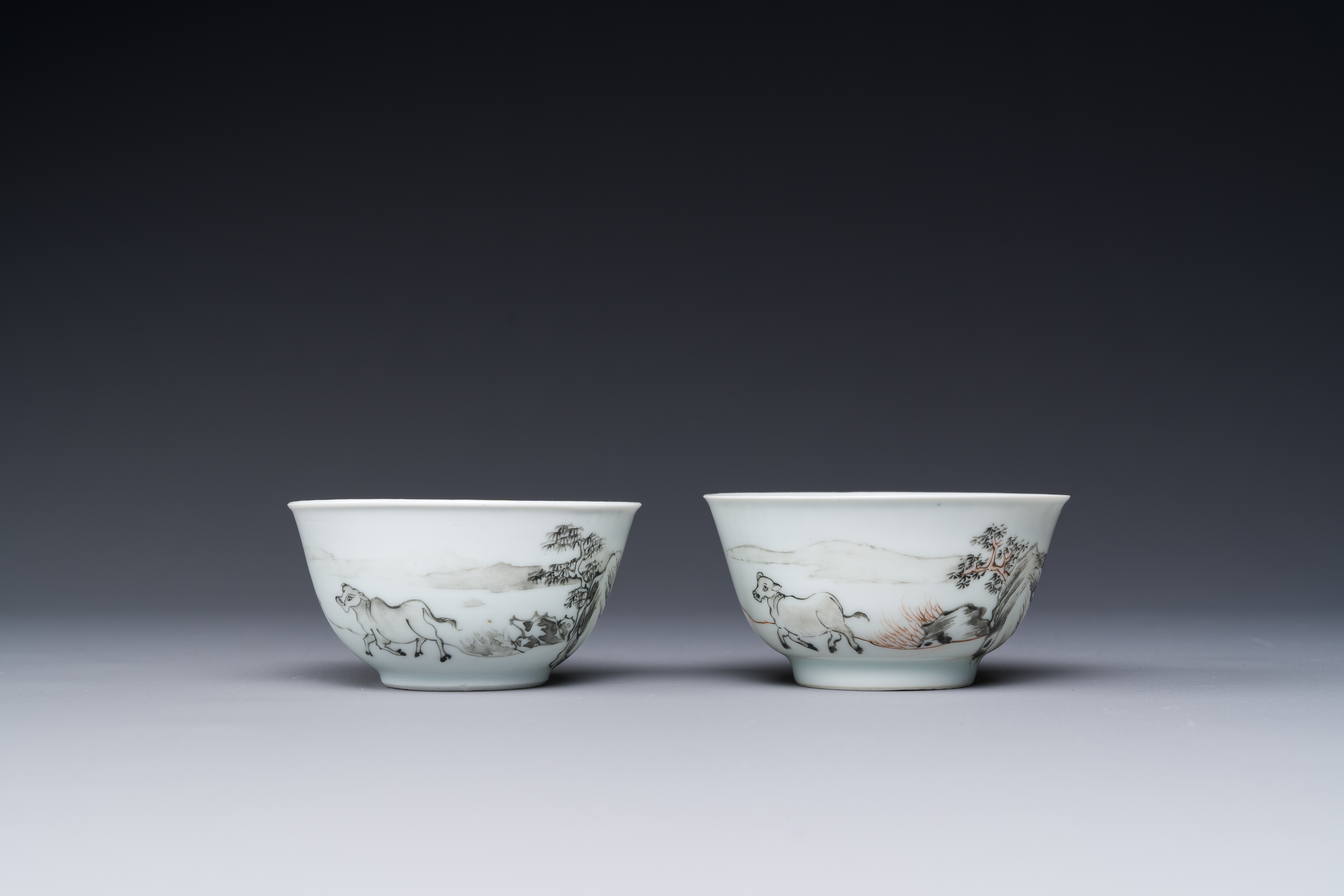 A pair of Chinese grisaille and iron-red 'buffalo' cups and saucers and a 'rooster' saucer, Yongzhen - Image 3 of 6