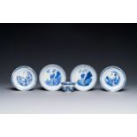 Four Chinese blue and white saucers and an 'erotic' cup, Kangxi