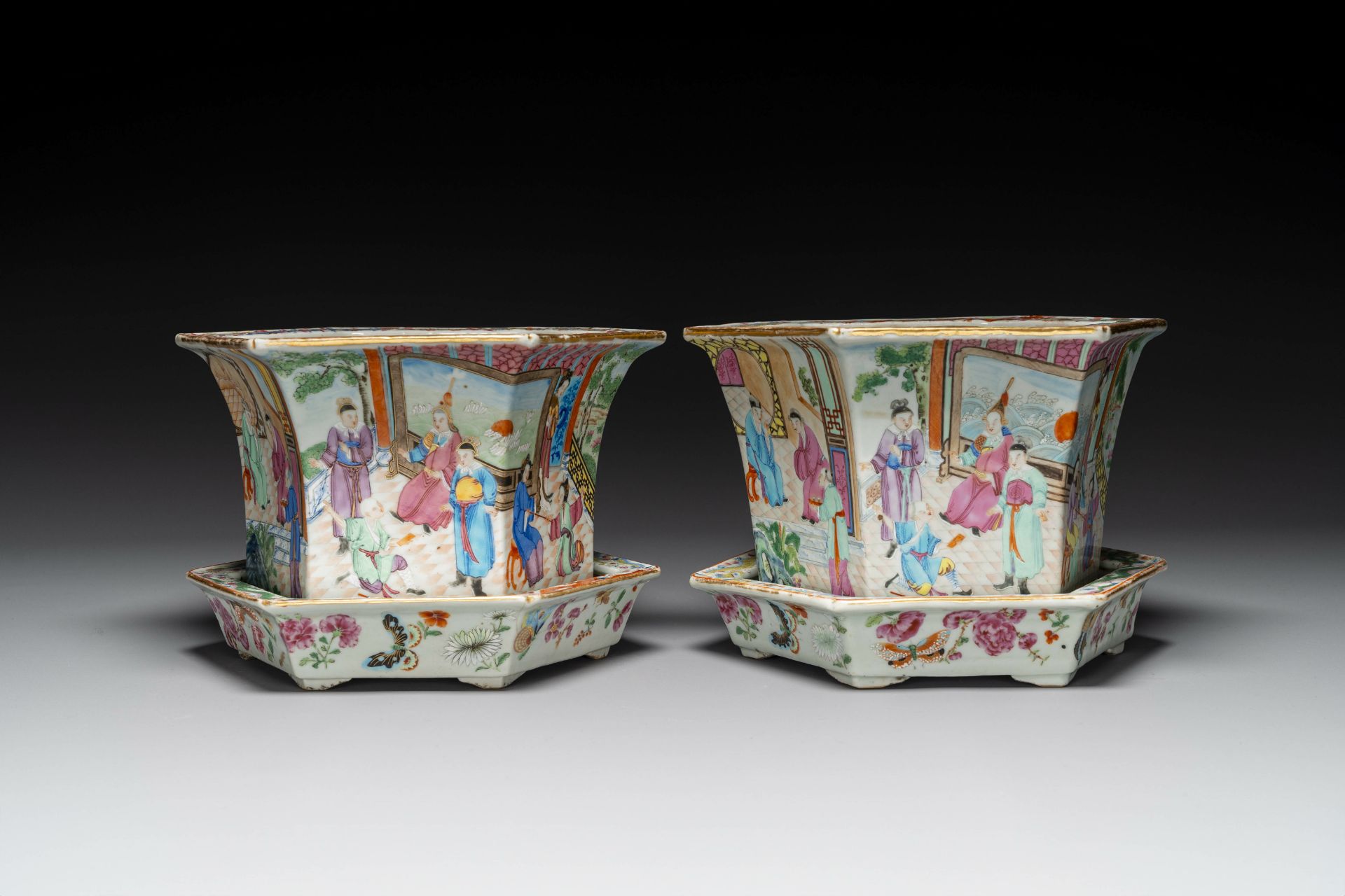 A pair of hexagonal Chinese Canton famille rose jardinieres on stands, 19th C.