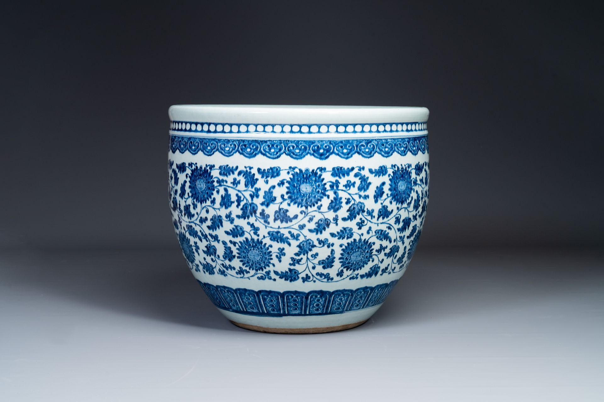A large Chinese blue and white 'peony scroll' fish bowl, Qianlong/Jiaqing