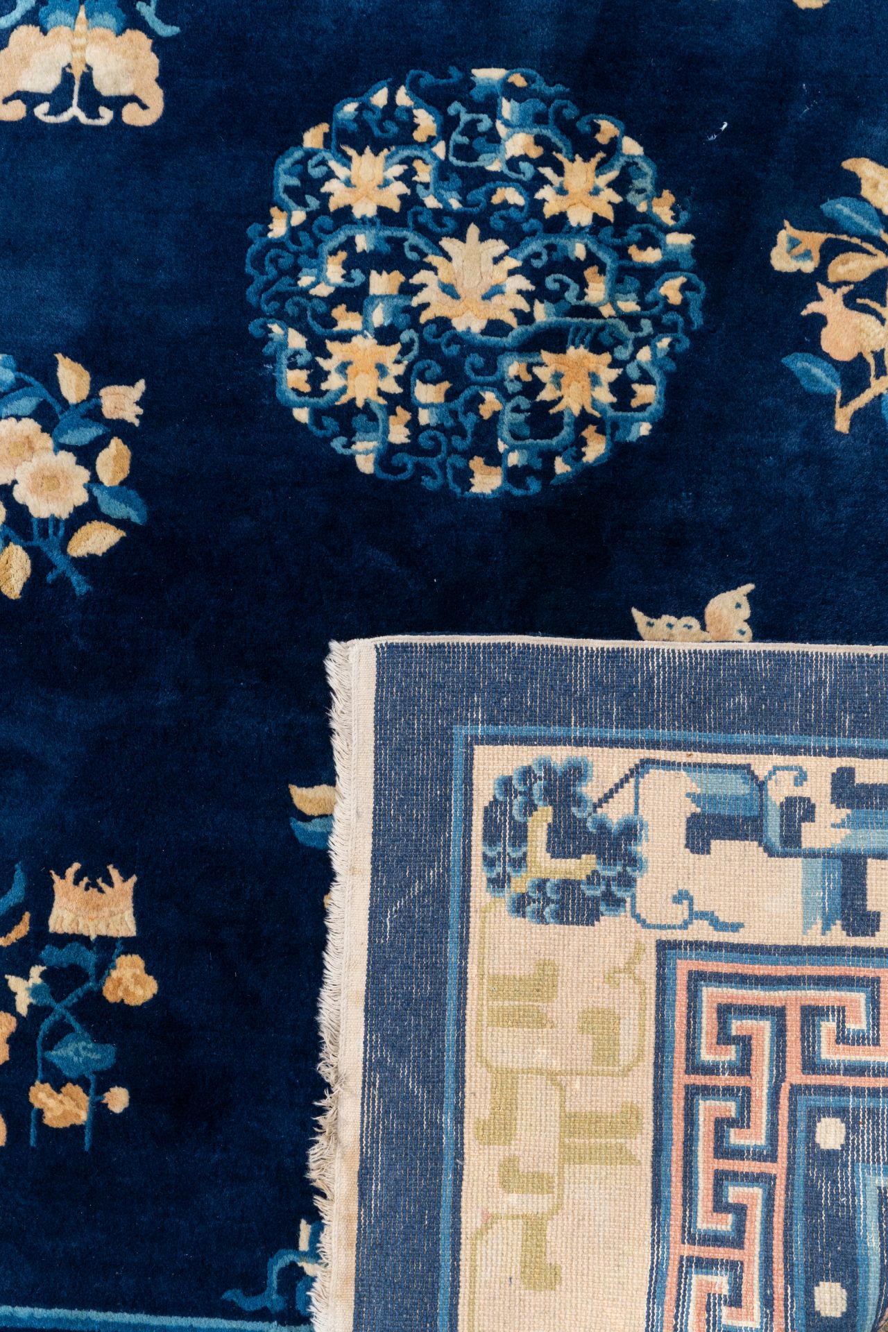 A large Chinese dark-blue-ground carpet with flowers and butterflies, 19/20th century - Image 5 of 5